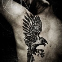 Big black ink fantasy style painted upper back tattoo of flying crow