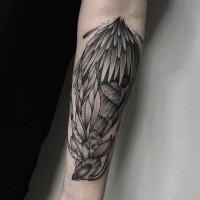 Big black ink forearm tattoo of little fish