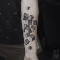 Big black ink geometrical tattoo on arm