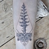 Big black ink lonely tree tattoo on forearm stylized with various ornaments