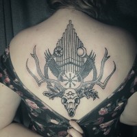 Big black ink mystical cult deer skull tattoo on back with organ
