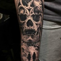 Big black ink mystical designed forearm tattoo of human skull, woman portrait and couple