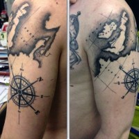 Big black ink nautical map tattoo on shoulder area