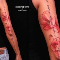 Big black ink sleeve tattoo of red flower and lettering