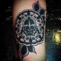 Big black ink tribal style flower tattoo on forearm stylized with little Vaders mask