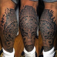 Big black ink tribal temple tattoo on leg combined with star shaped tablet