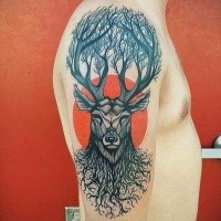 Big black ink upper arm tattoo of deer with trees