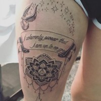 Big black ink very detailed banner with lettering tattoo on thigh stylized with flower, stars and bird