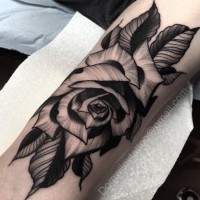 Big black ink very detailed rose flower tattoo on forearm