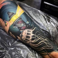 Big cartoon like colored light house with jellyfish tattoo on arm