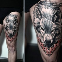 Big colored abstract wolf tattoo on thigh combined with colored ornaments