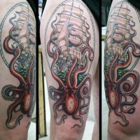 Big colored amazing detailed nautical tattoo with ship and octopus on thigh