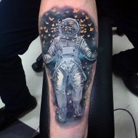 Big colored spaceman with butterflies tattoo on arm