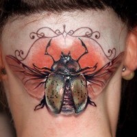 Big colorful bug tattoo on a nape tattoo by Robert Pena