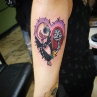 Big colorful heart shaped tattoo on arm with Nightmare before Christmas couple