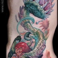 Big colorful side tattoo of alien like plan with leaves