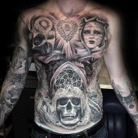 Big creepy looking chest and belly tattoo of various demonic faces and heart