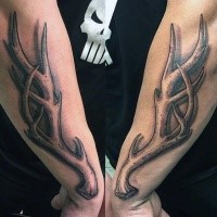 Big detailed looking engraving style deer horn tattoo on sleeve
