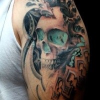 Big fantasy style colored shoulder tattoo of human skull