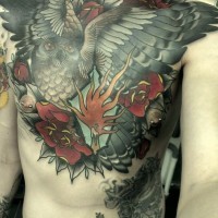 Big flying owl and red flowers tattoo on chest