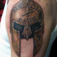 Big golden like corrupted warriors helmet with lettering on upper arm
