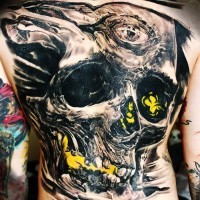 Big horrendous  black skull tattoo on back