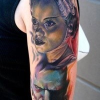 Big illustrative style shoulder tattoo of woman and monster face