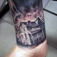 Big multicolored lonely house with alien ships tattoo on wrist