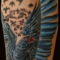 Big natural looking crow tattoo on forearm