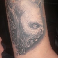 Big natural looking detailed orc head tattoo o arm