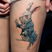 Big natural looking detailed rabbit with old clock tattoo on thigh zone