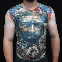 Big nautical themed colored tattoo on whole chest and belly of smoking sailor and sailing ship