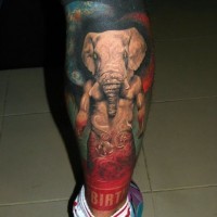 Big nice colored very detailed mystic God with elephant head tattoo on leg with lettering