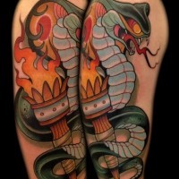 Big old school colored detailed snake tattoo on shoulder with torch