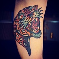 Big old school style colored arm tattoo of roaring leopard