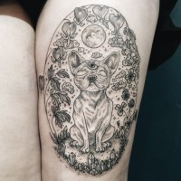 Big oval shaped mystical dog portrait tattoo on thigh stylized with various flowers and moon