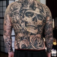 Big skull and roses tattoo on back
