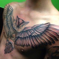 Big soaring owl with a symbol of freemasons tattoo on chest