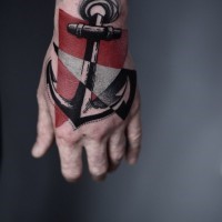 Big steel anchor and colored triangles tattoo on hand