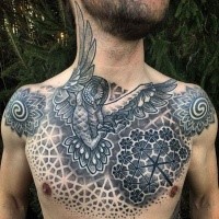 Big stippling style chest tattoo of owl with flower shaped ornaments