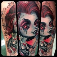 Big very beautiful painted and colored evil witch tattoo on forearm stylized with red hearts