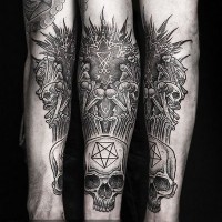 Big very detailed black and white cult statue with skull tattoo on arm