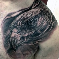 Big very realistic looking black ink detailed eagle tattoo on chest