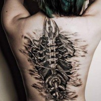 Biomechanical spine tattoo on back for girls