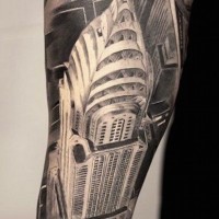 Bird view like black and white detailed forearm tattoo of Empire State Building