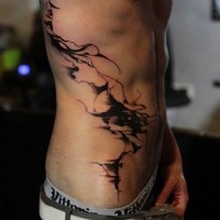 Black abstraction tattoo on ribs for men