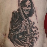 Black and gray death with scythe tattoo on ribs