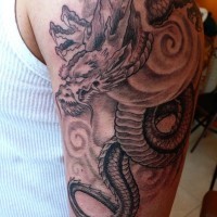 Black and gray dragon tattoo on half sleeve by fiesta