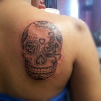 Black and gray mexican sugar skull tattoo on shoulder blade