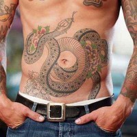 Black and gray snake with flowers tattoo on belly